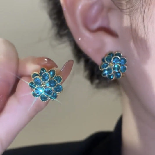 Peacock blue earrings with small flowers